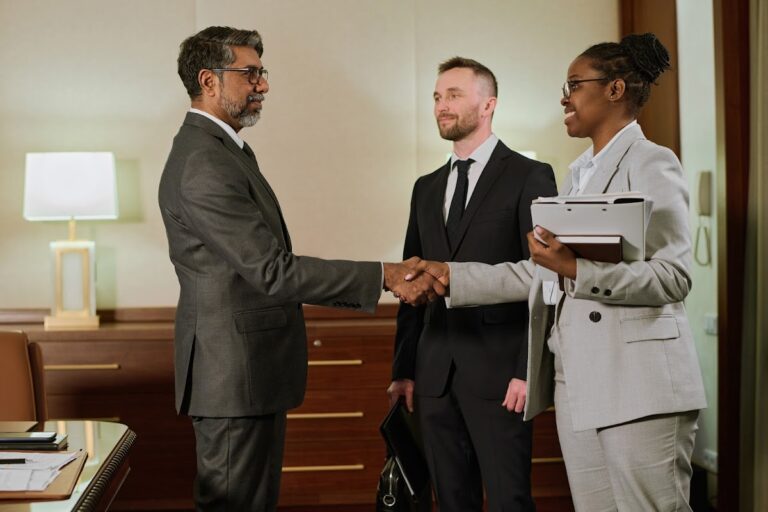 Professional Florida lawyer meeting with clients to provide legal advice after a car accident.